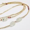 Sautoir en perles baroques Préhnite, Grenat lie de vin et perles japonaises dorées Miyuki